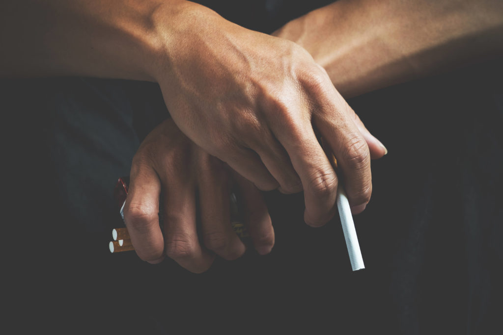 hand holding a cigarette